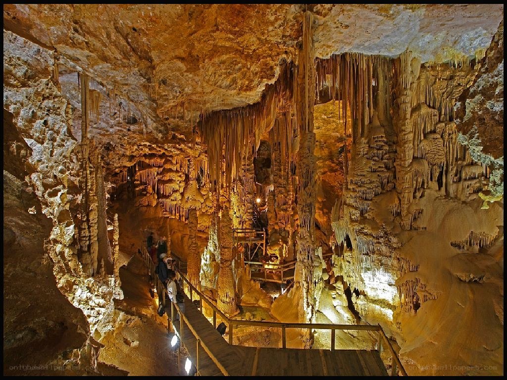 Cave with stalactites and visitors
