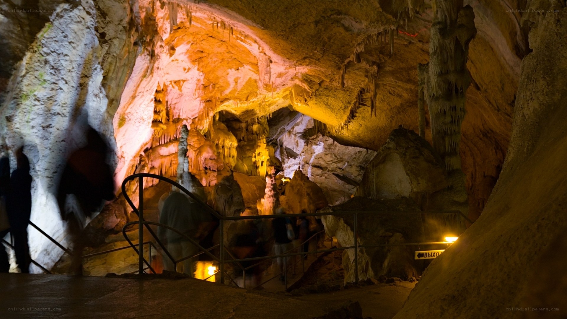 Cave with stalactites and visitors