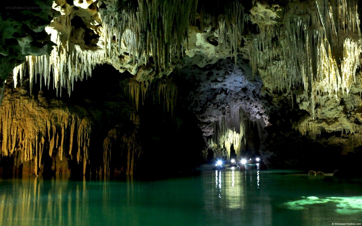 cave with stalactites and water
