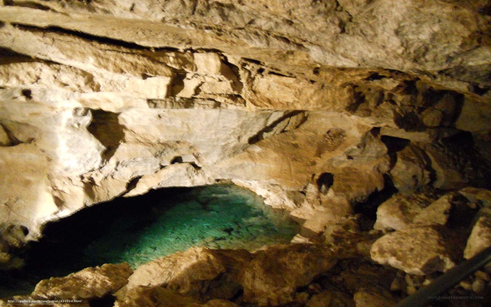 cave with turquoise pool