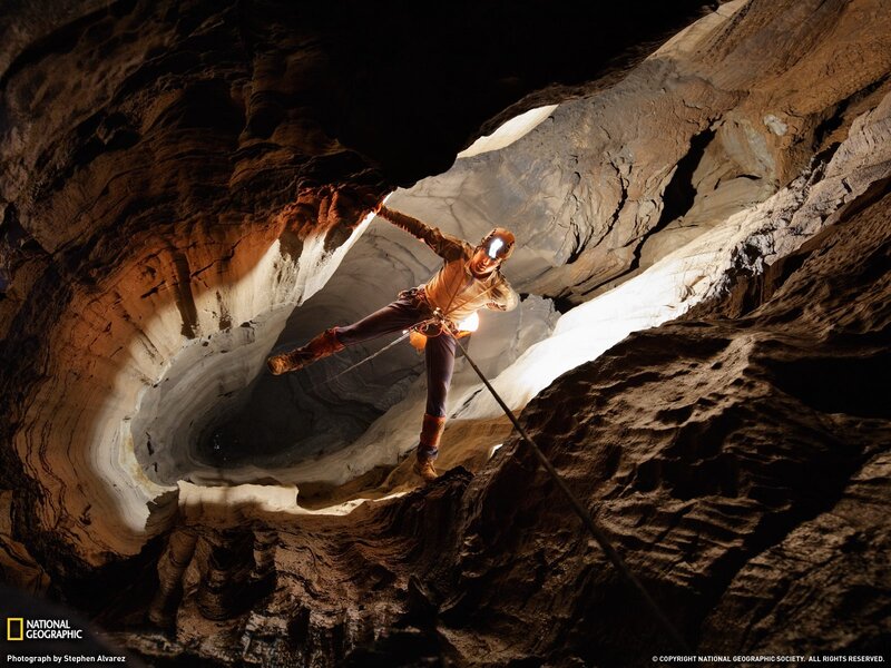 Caver exploring a cave