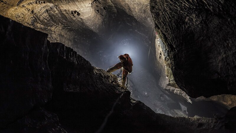Caver in a Cave