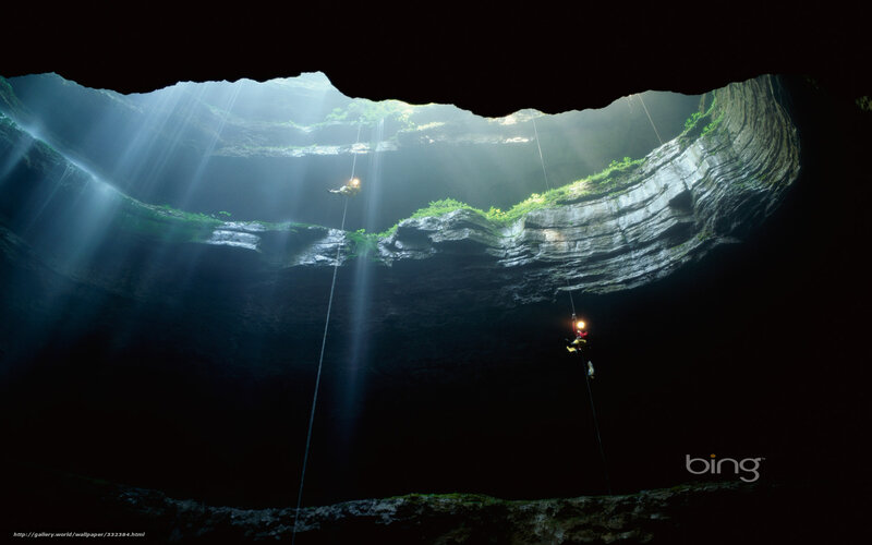 Cavers in a deep cave