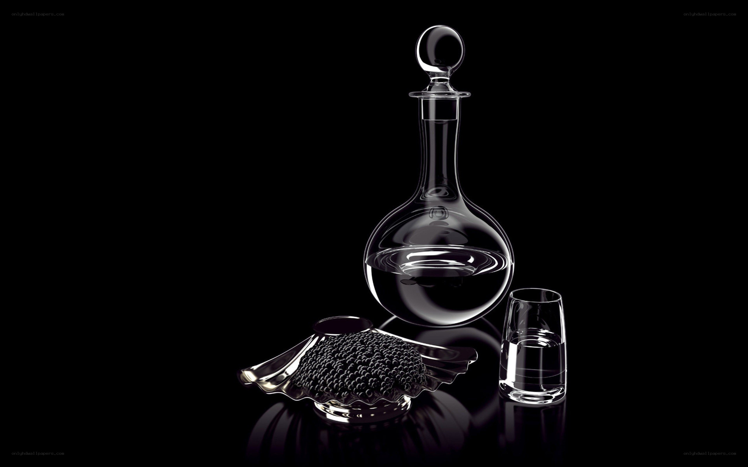 Caviar and decanter on black