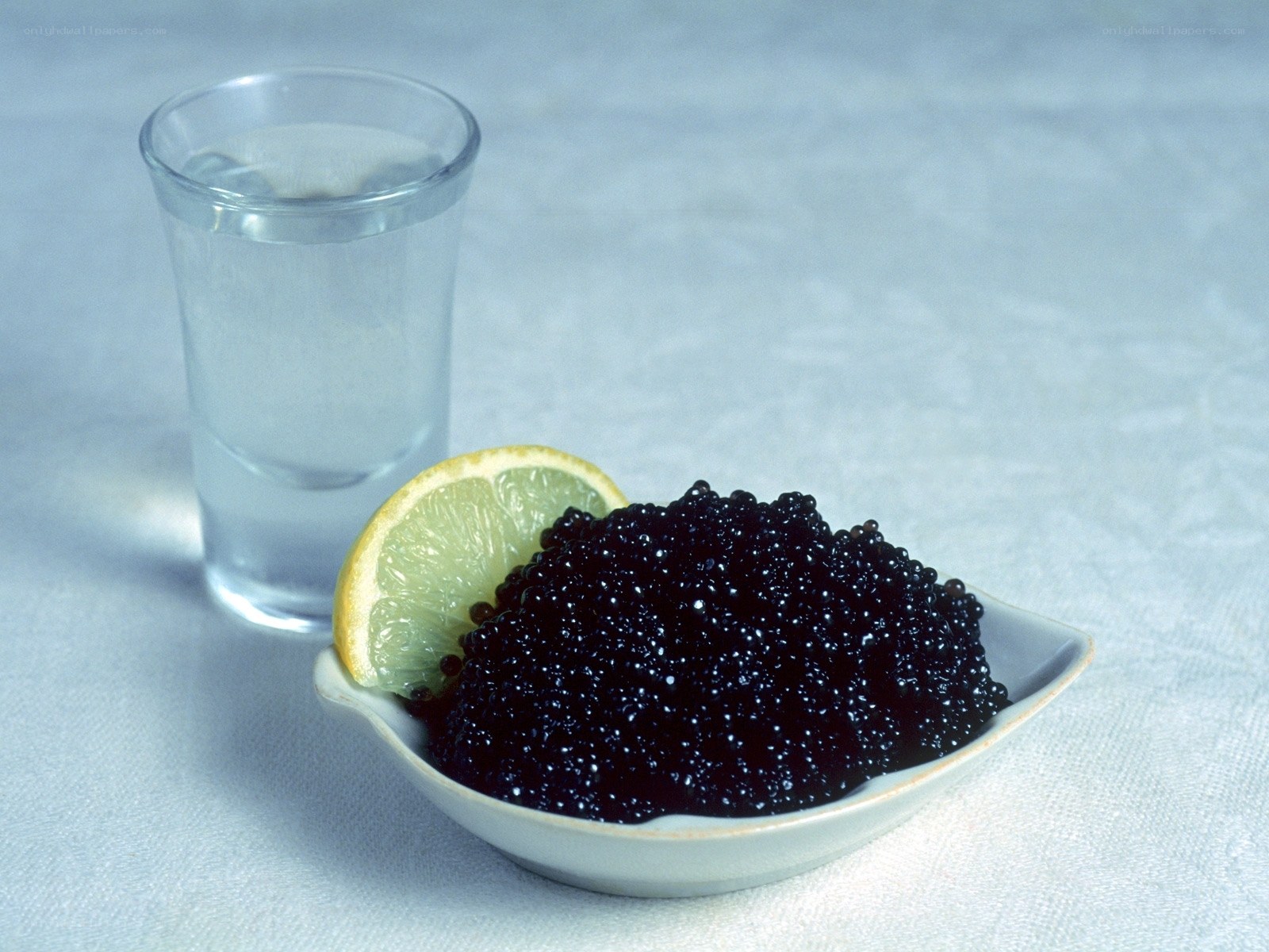 Caviar with lemon and vodka