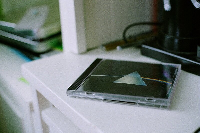 CD case on a white shelf