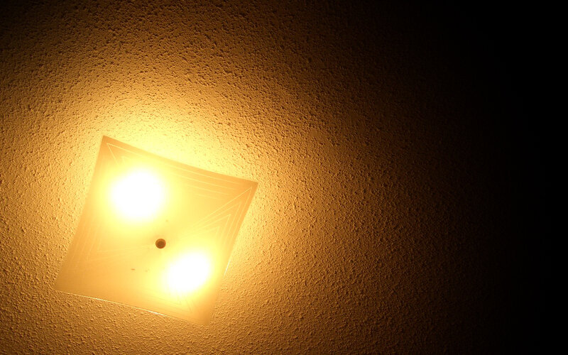 ceiling light fixture on textured wall