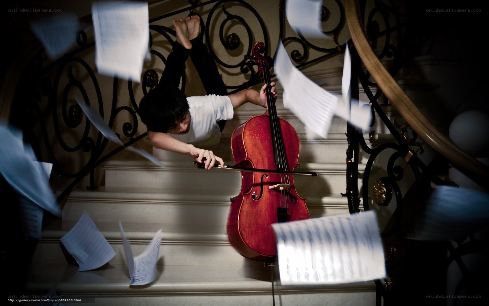 Cellist on staircase with sheet music