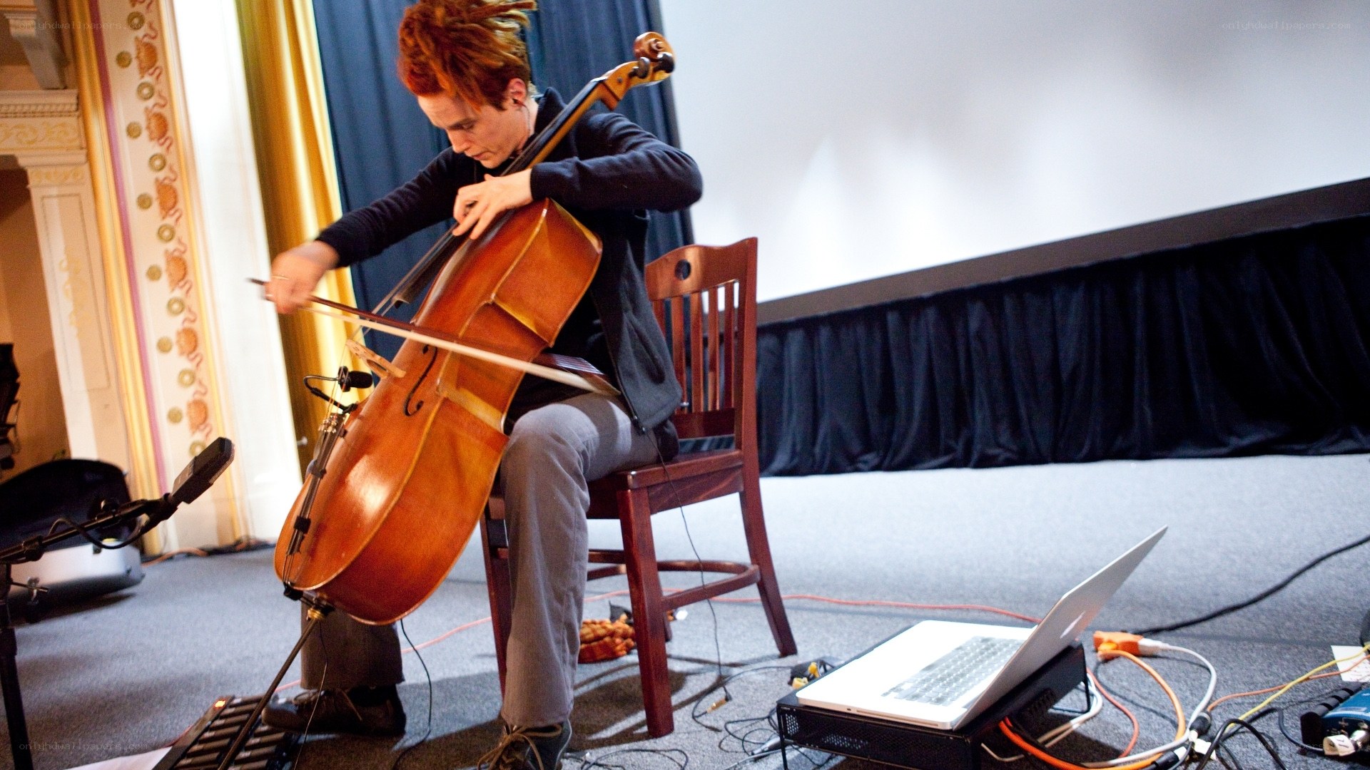 Cellist performing on stage