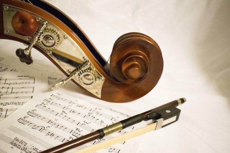 Cello and bow on sheet music