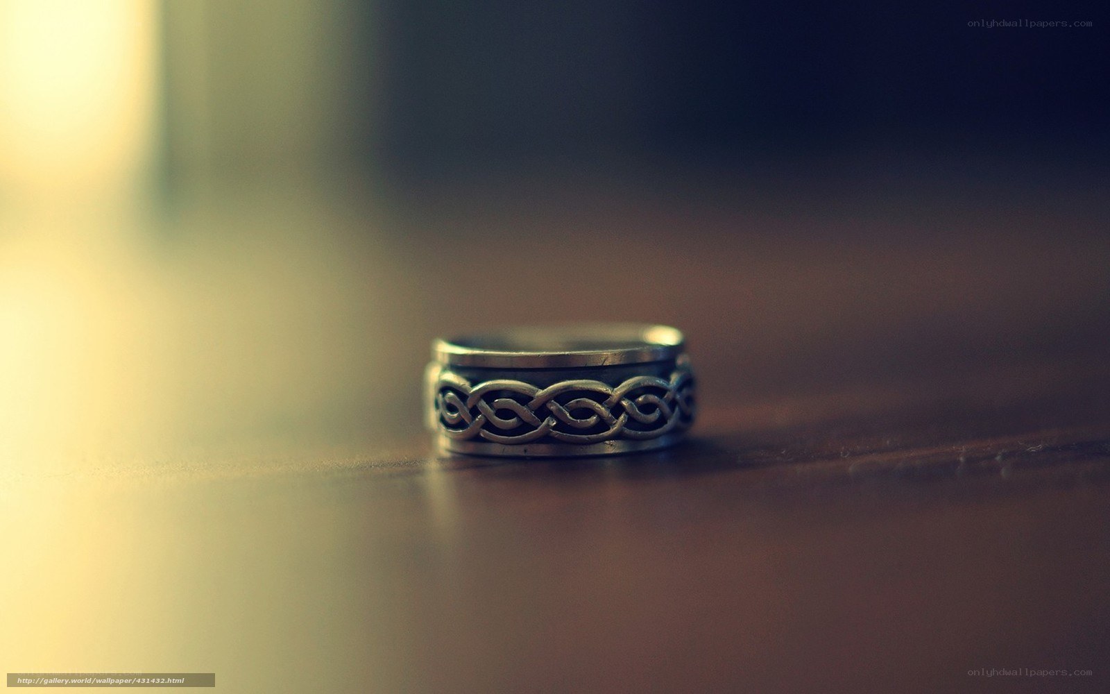 Celtic ring on wooden surface