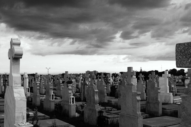Cemetery under stormy sky