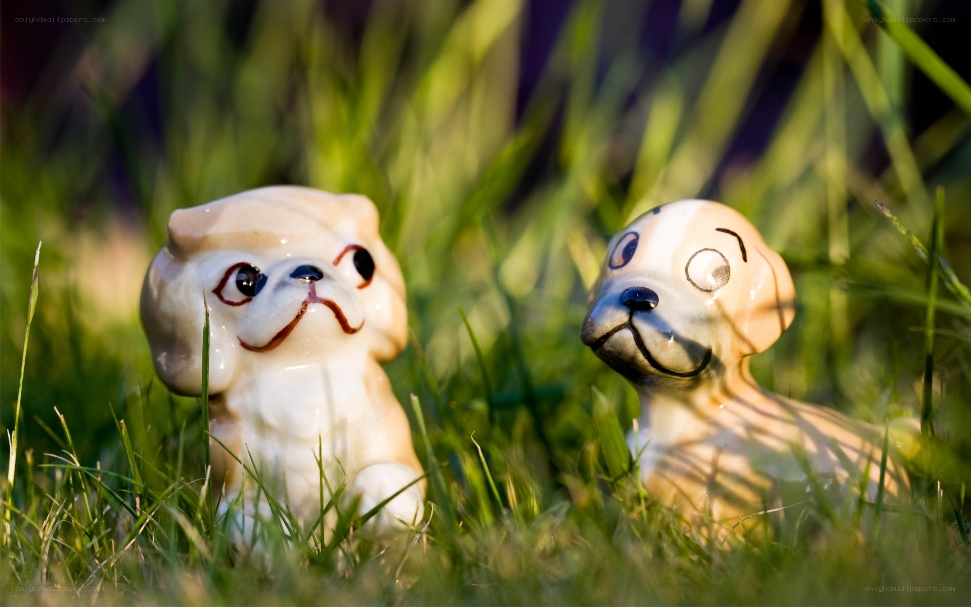 ceramic dog figurines in grass