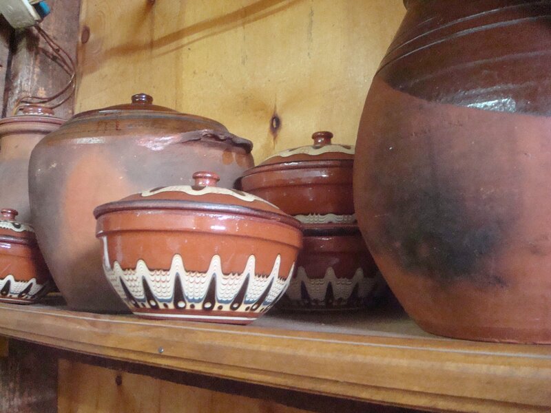 ceramic pots on a shelf