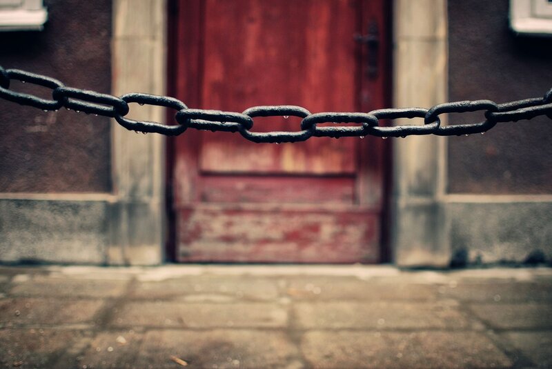 chain blocking a red door