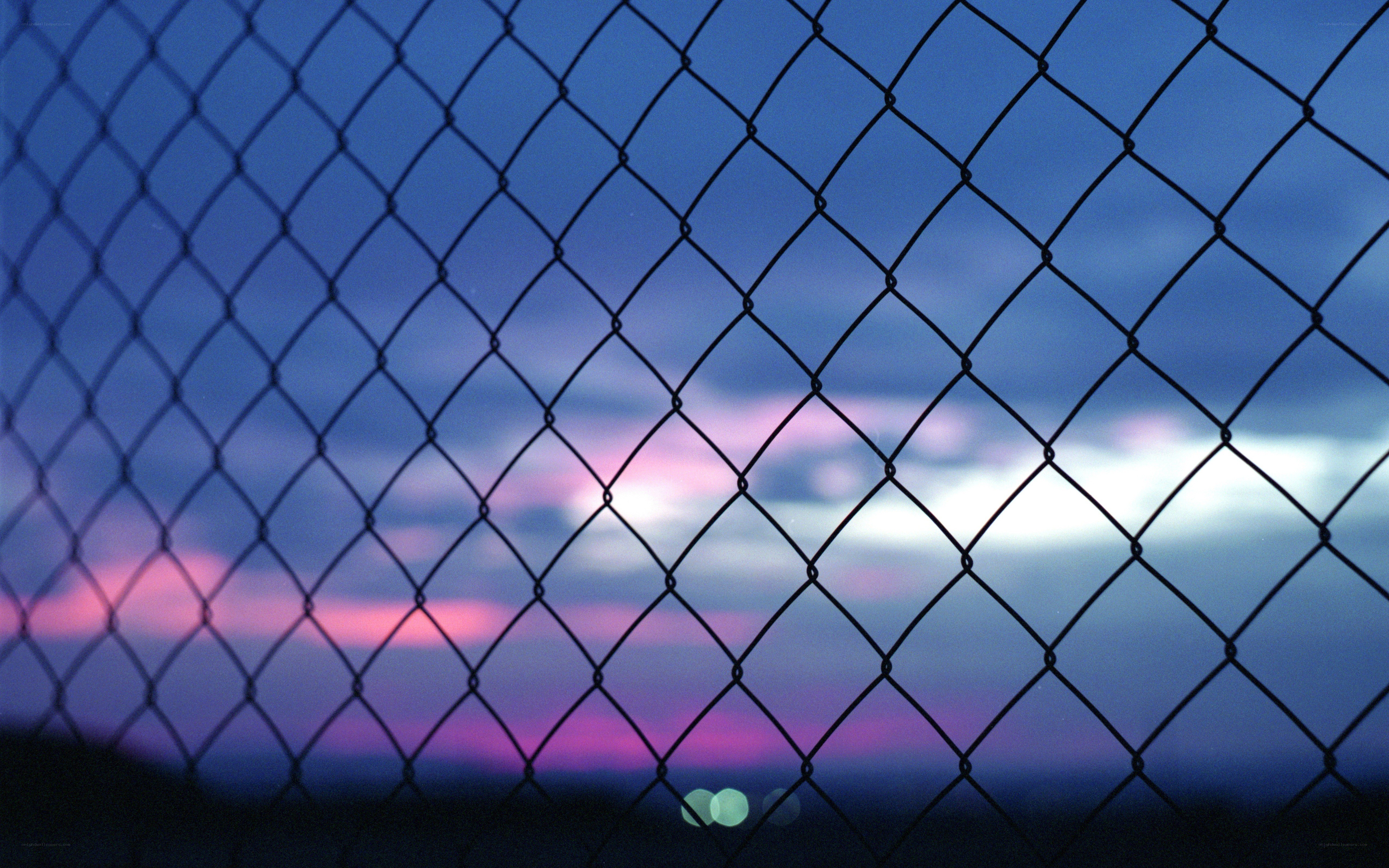 Chain-link fence at dusk
