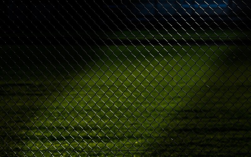 chain-link fence at night