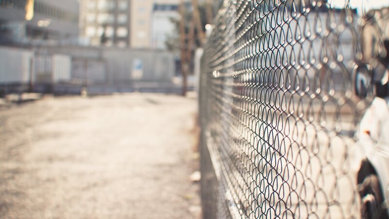 chain-link fence in urban area