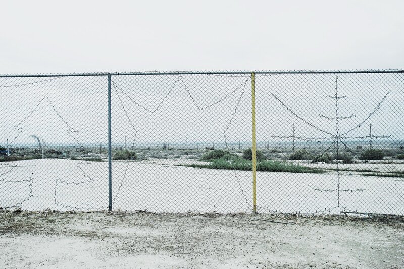 chain-link fence with barbed wire