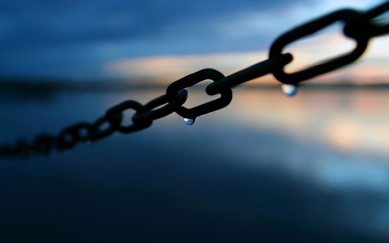 chain with water droplets at dusk