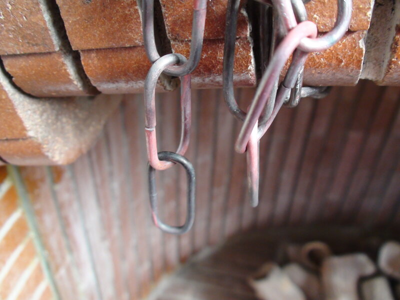 chains hanging from brick structure