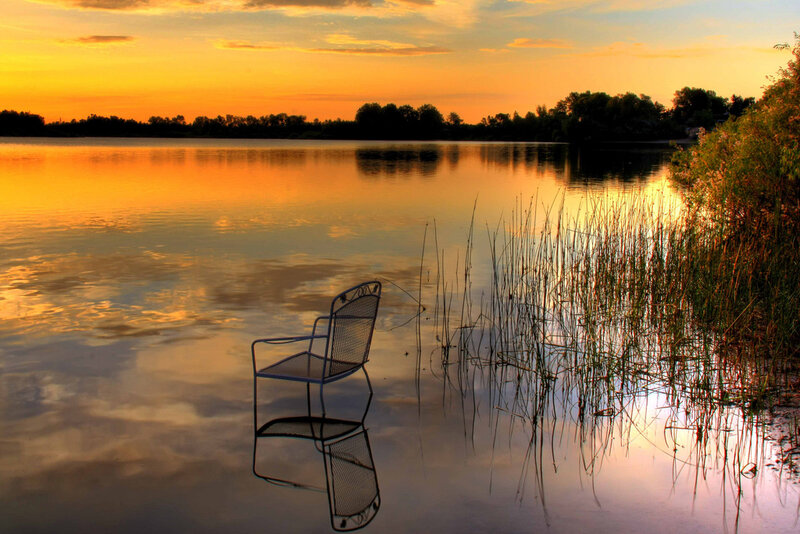 Chair in Lake at Sunset
