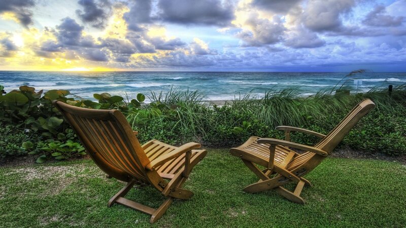 Chairs at sunset by the ocean