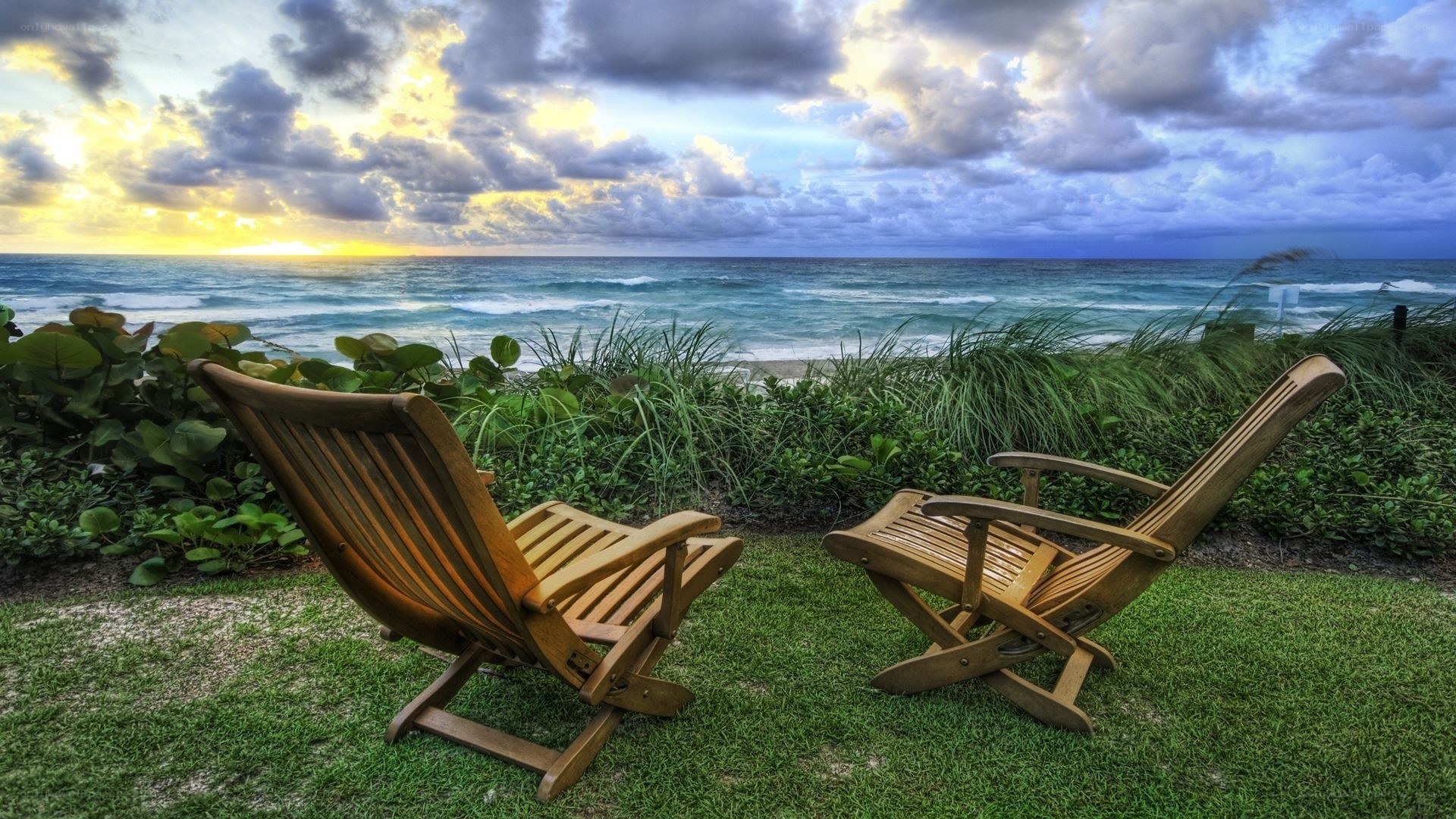 Chairs at sunset by the ocean