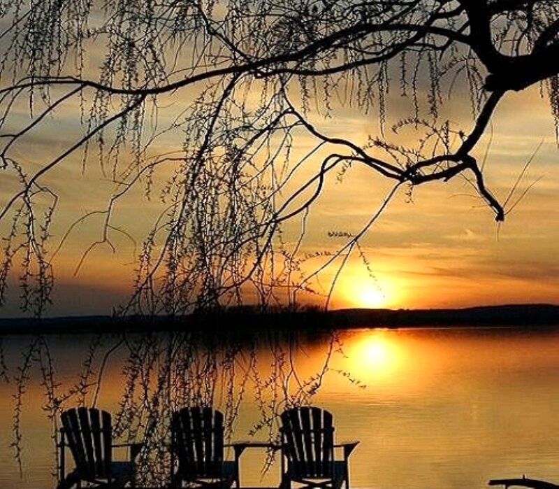 Chairs by Lake at Sunset