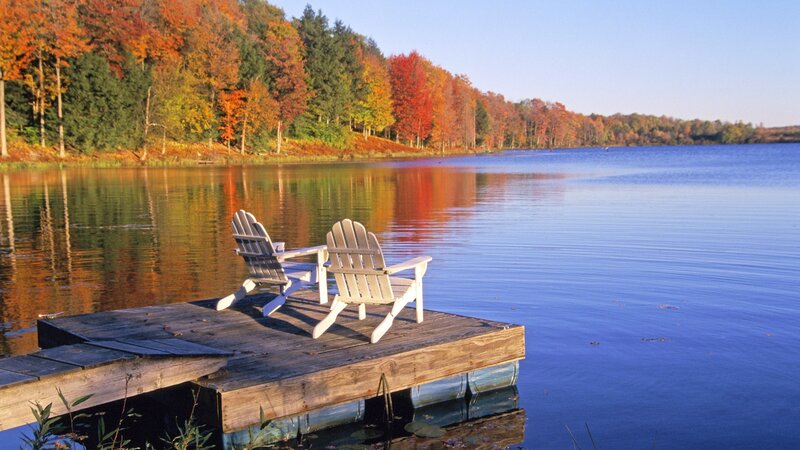 Chairs on a dock by a lake