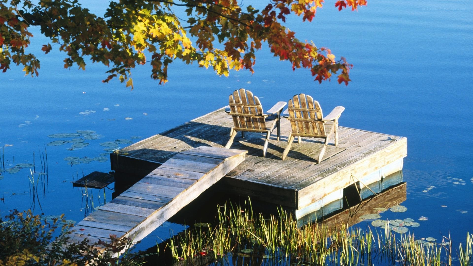 Chairs on a dock by the lake