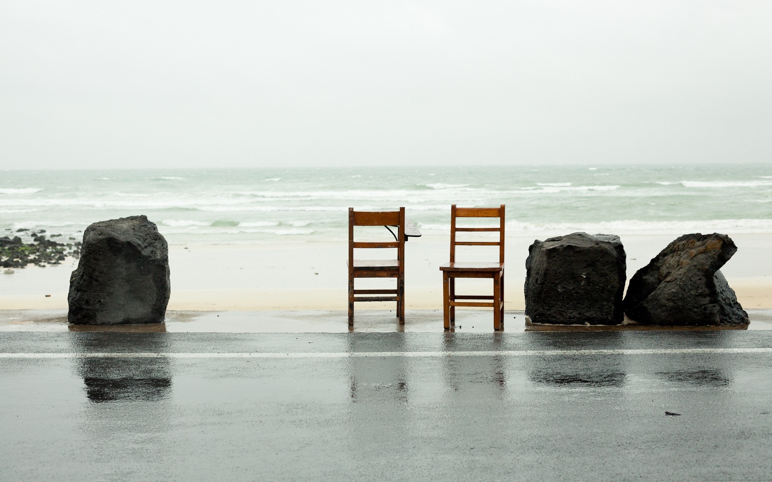Chairs on a rainy beach