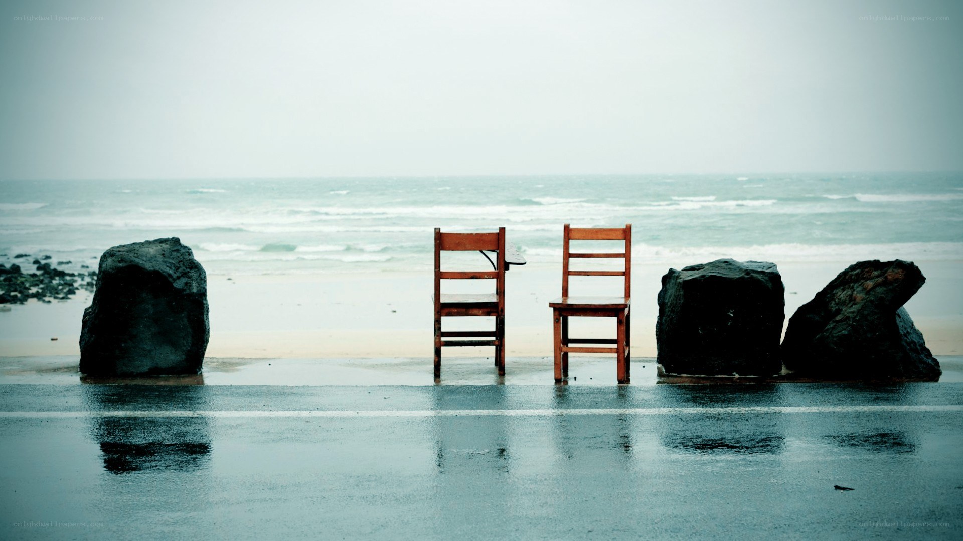 Chairs on a rainy beach