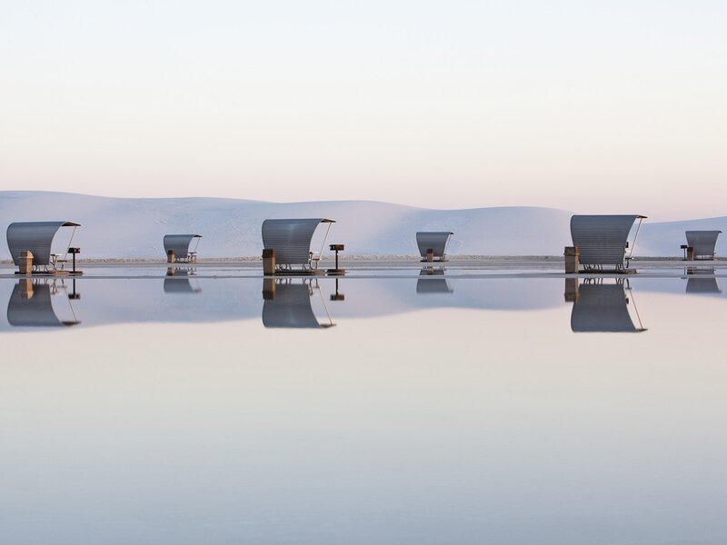 Chairs on a reflective surface