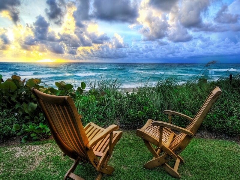Chairs overlooking ocean sunset