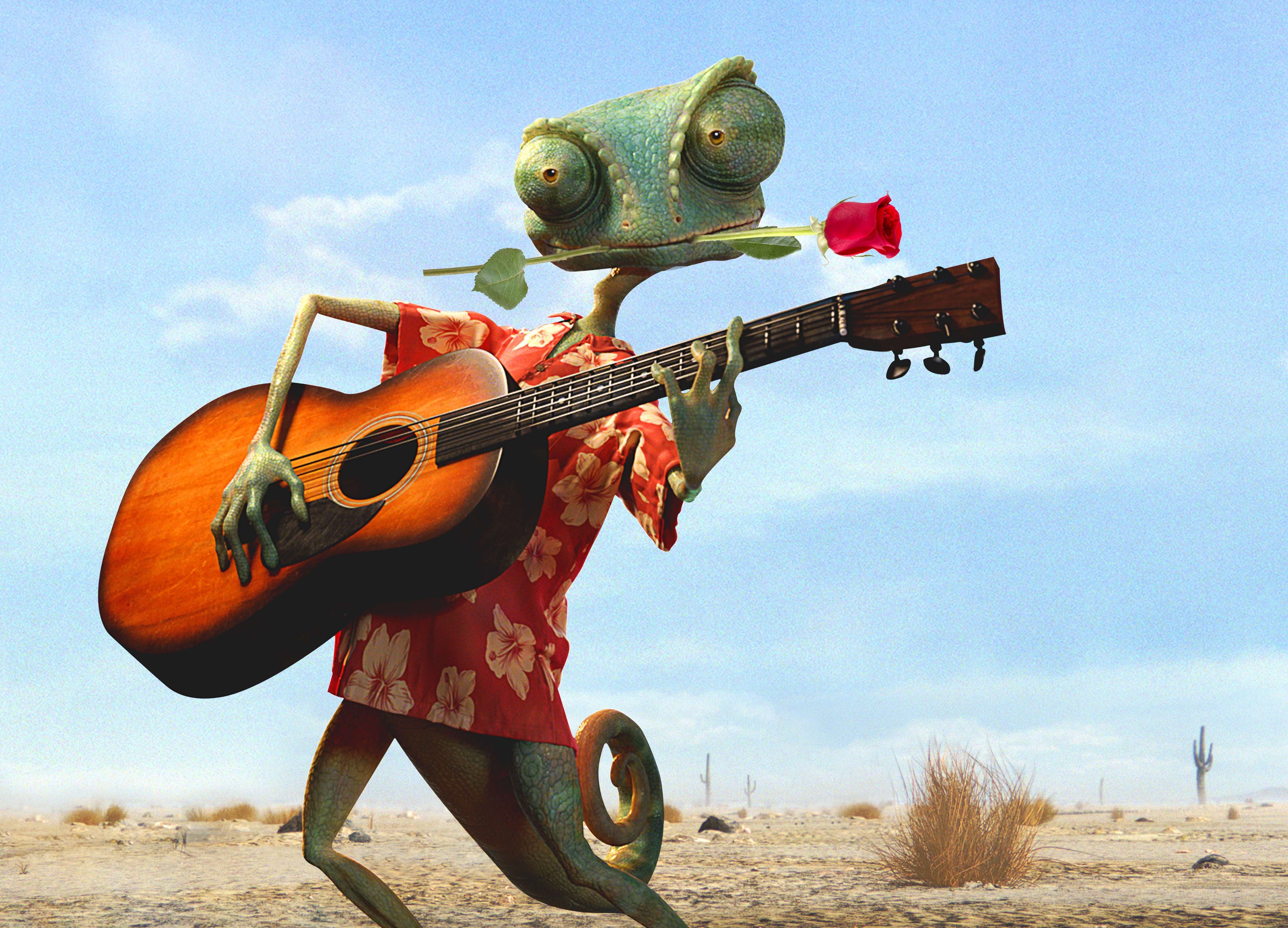 chameleon playing guitar in desert