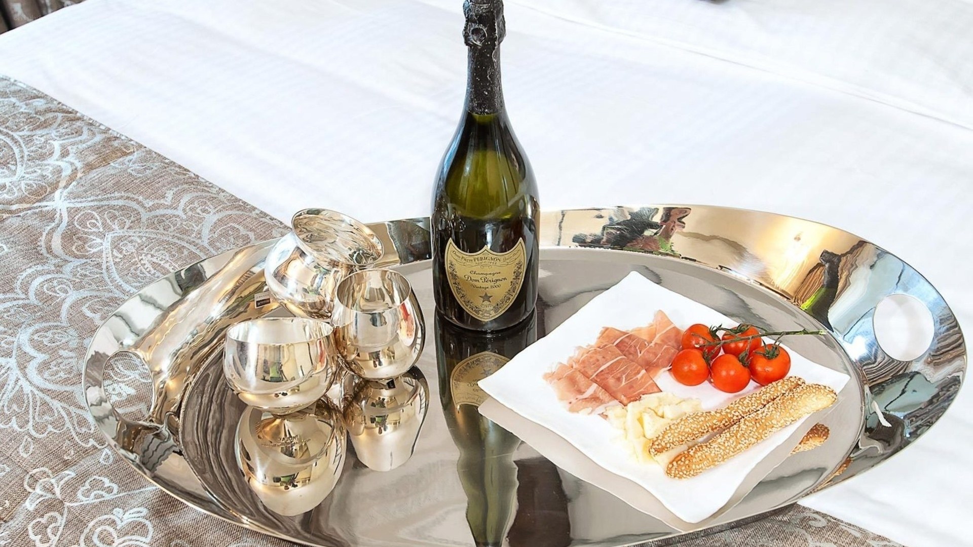 Champagne and appetizers on tray