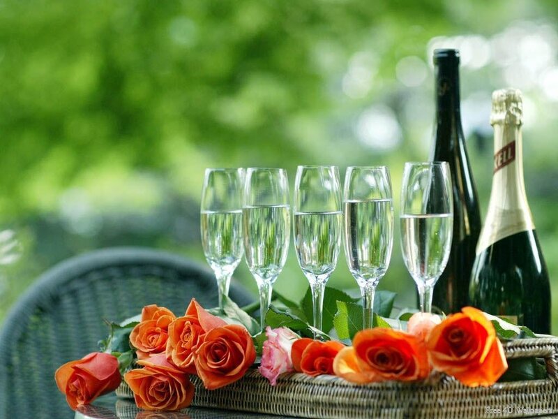 Champagne and roses on a tray