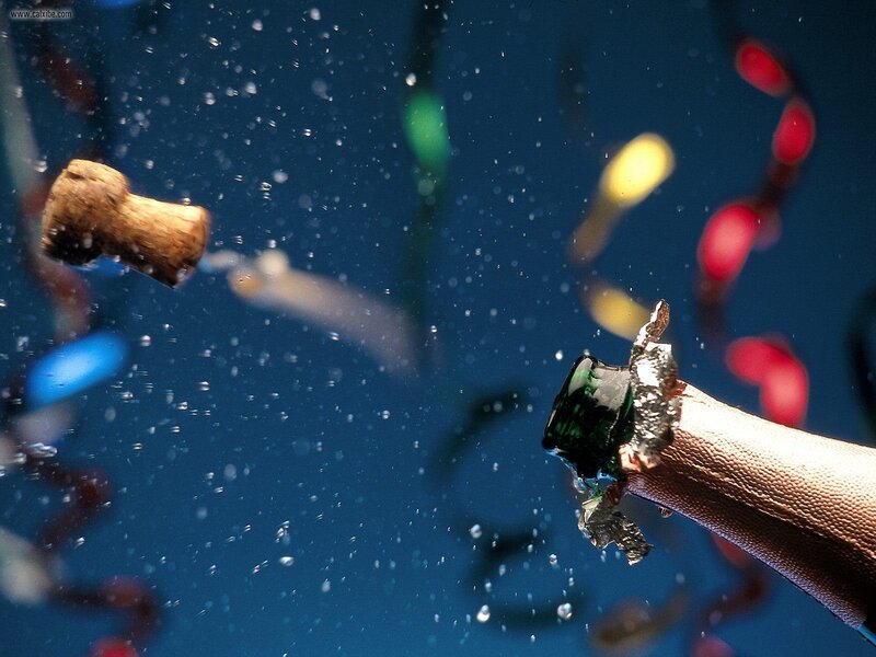 Champagne bottle popping underwater