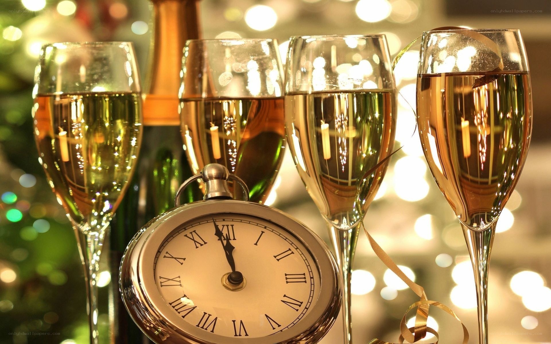 Champagne glasses and clock at midnight
