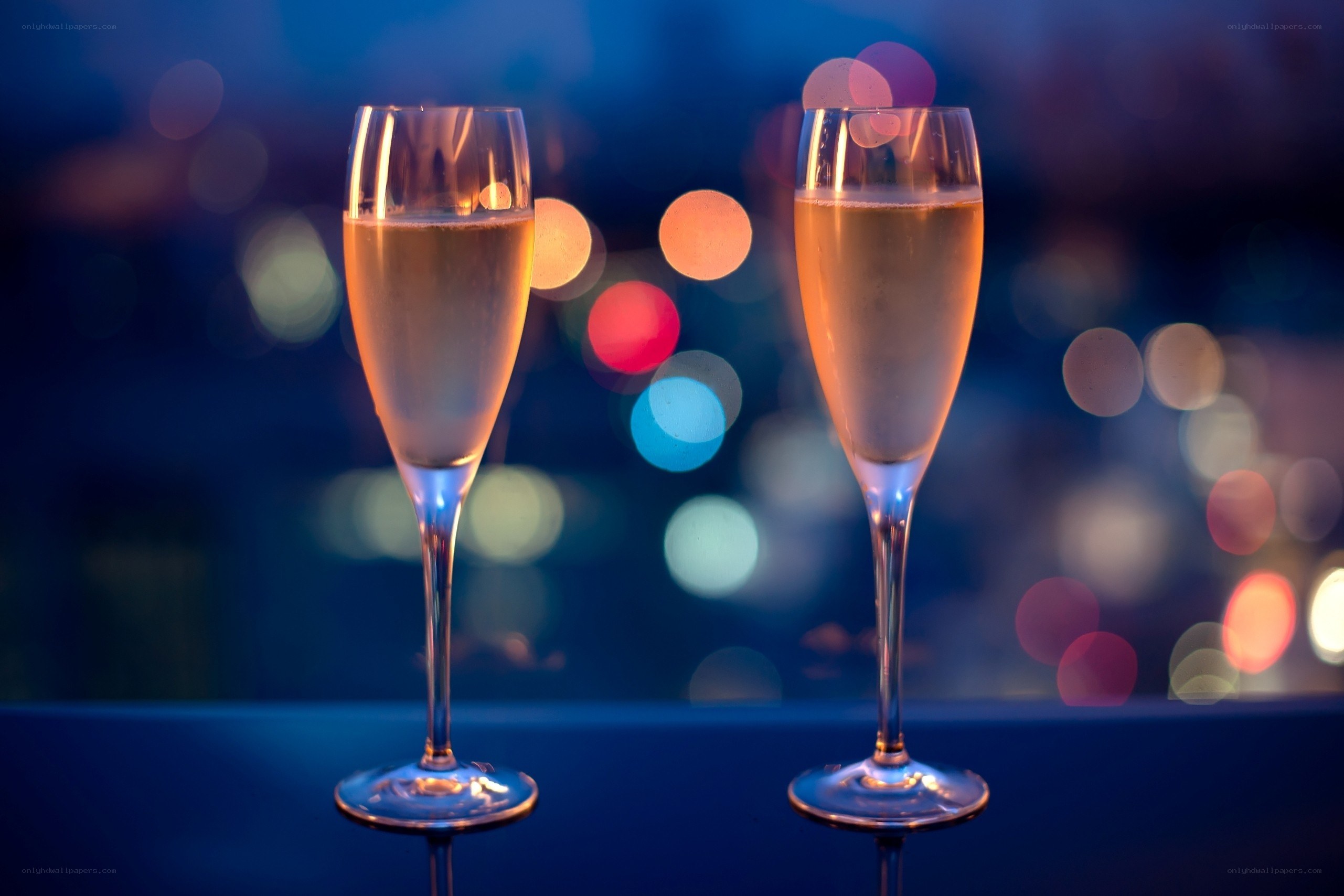 Champagne glasses at night