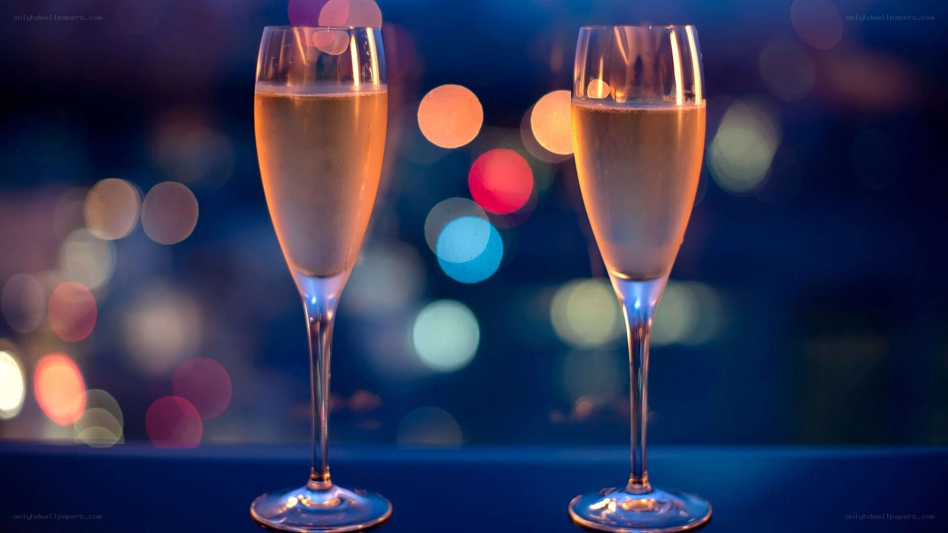 Champagne glasses at night