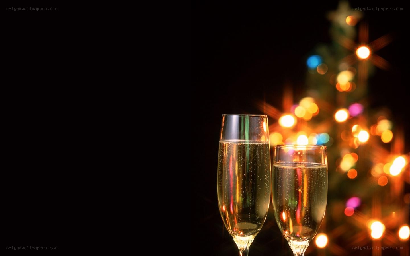 Champagne glasses by Christmas tree