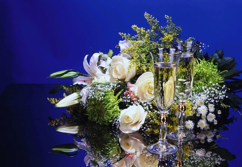 Champagne glasses with floral arrangement