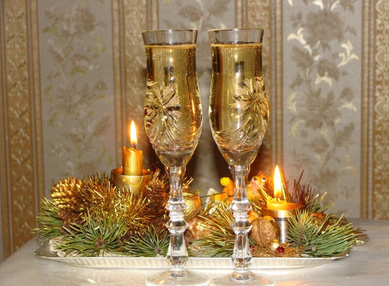 Champagne glasses with holiday decor