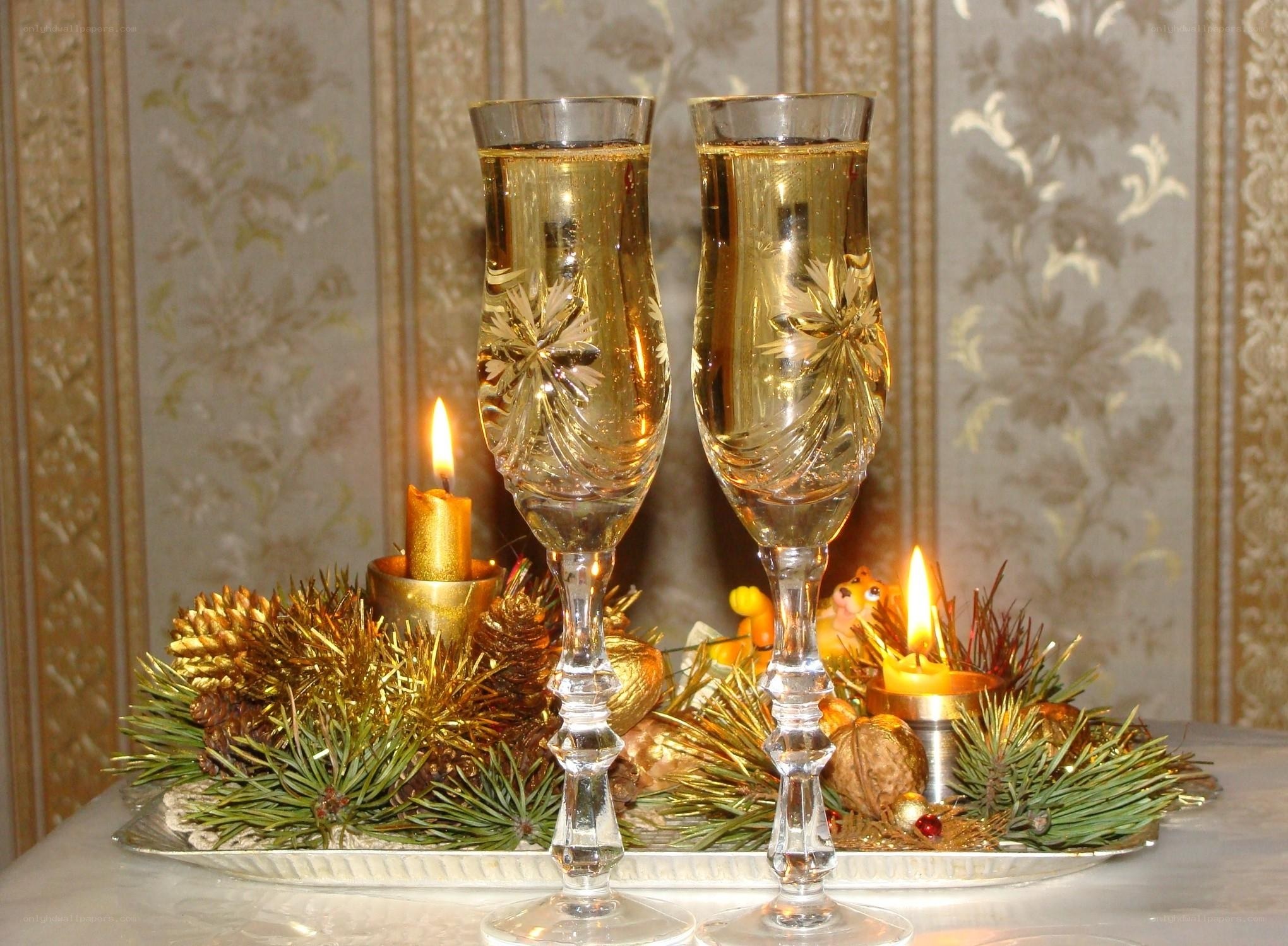 Champagne glasses with holiday decor