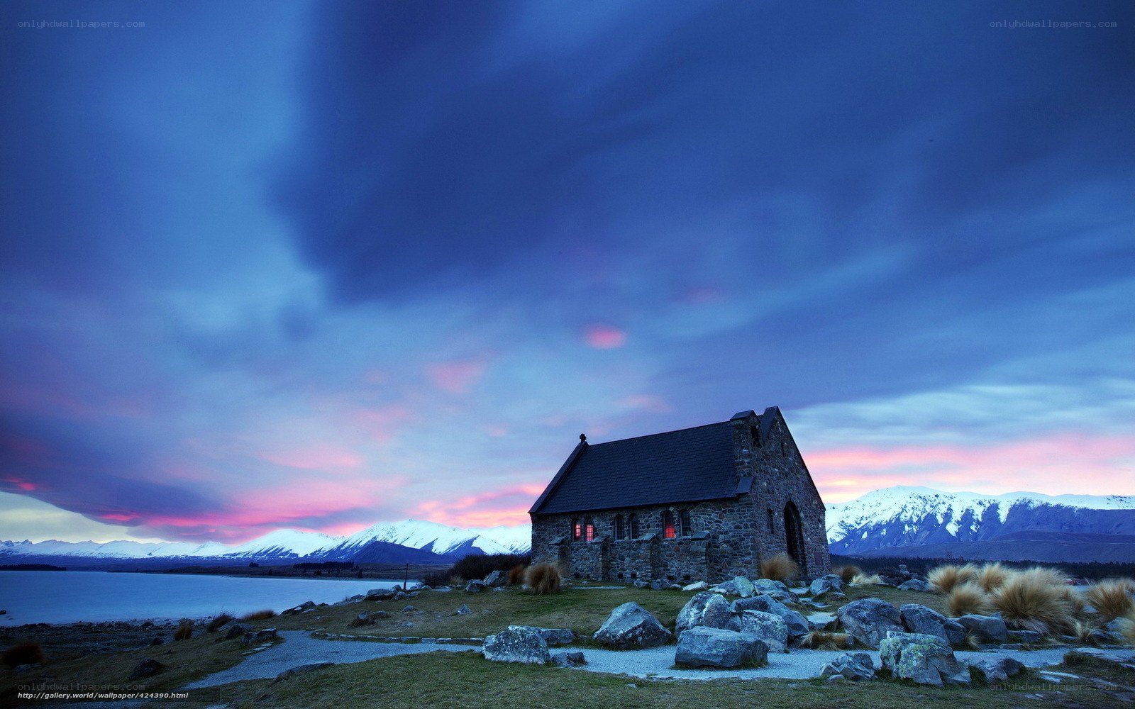 Chapel at sunset with mountains