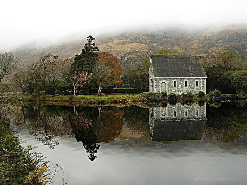 Chapel by a misty lake