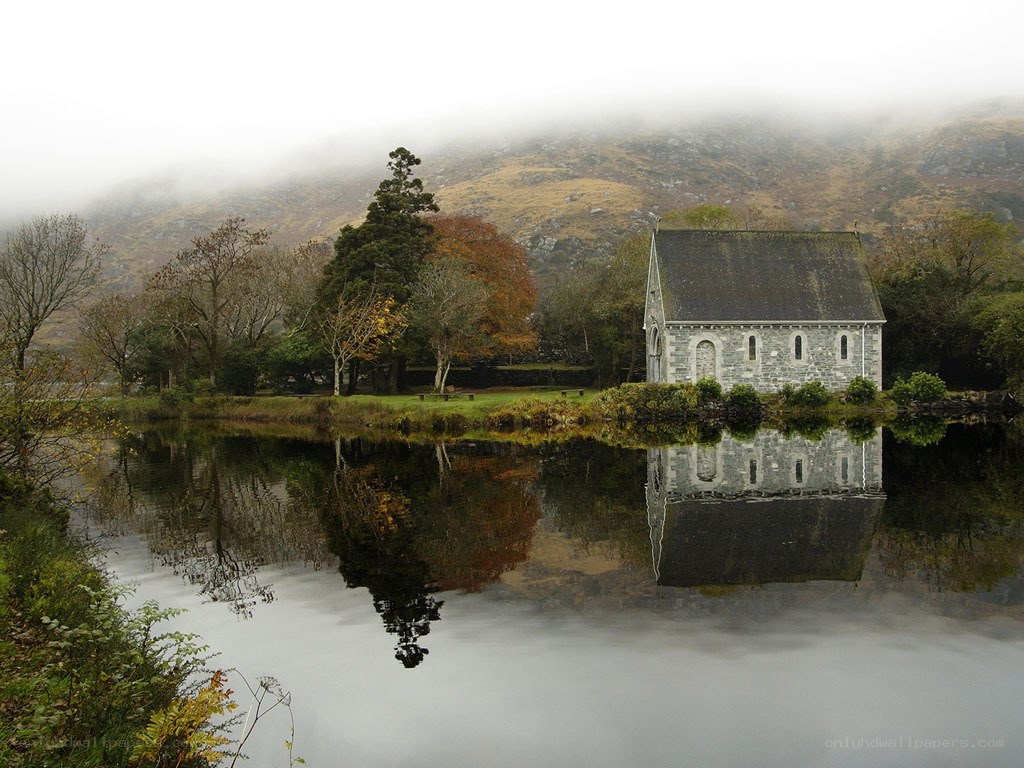 Chapel by a misty lake