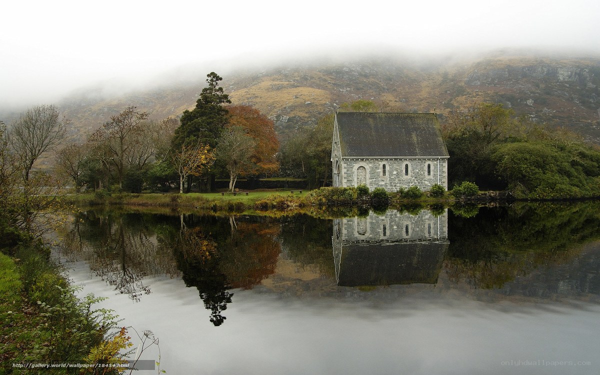 Chapel by a misty lake